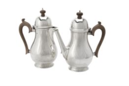 A silver baluster coffee pot and hot water jug by Blackmore & Fletcher Ltd.