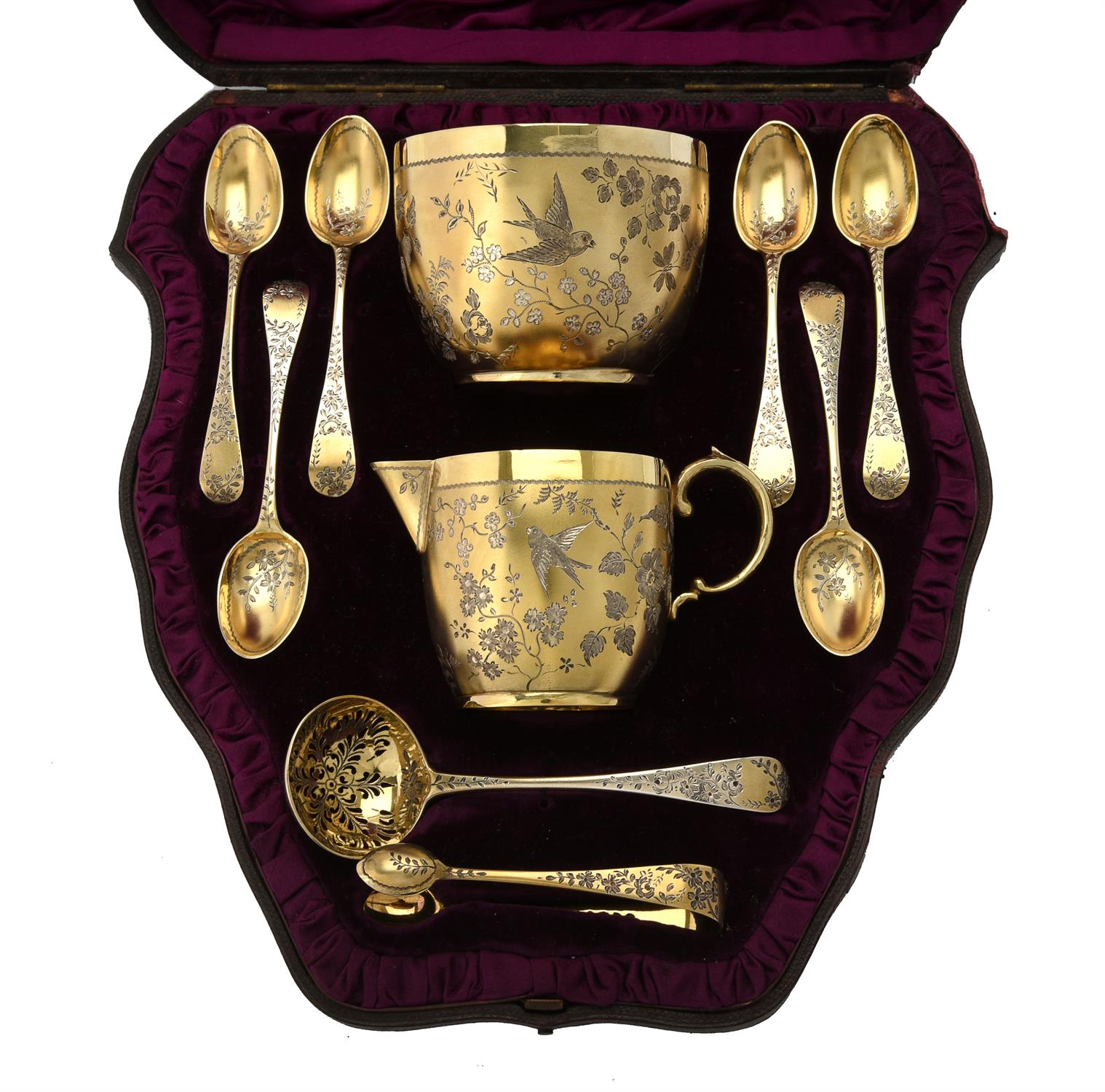 A Victorian silver gilt cream jug, sugar bowl, sifting spoon, six tea spoons and a pair of sugar ton - Image 2 of 2