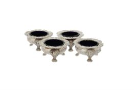 A set of four George IV silver shaped circular cauldron salts by Joseph Angell I