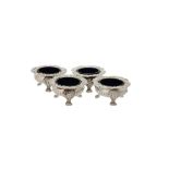 A set of four George IV silver shaped circular cauldron salts by Joseph Angell I