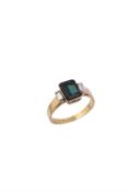 A green tourmaline and diamond three stone ring