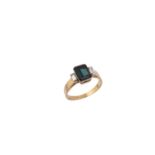 A green tourmaline and diamond three stone ring