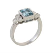 A diamond and aquamarine seven stone ring