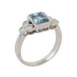 A diamond and aquamarine seven stone ring