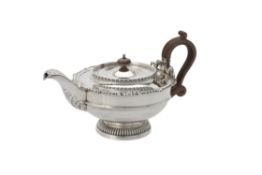 A silver tea pot by James Dixon & Son