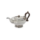 A silver tea pot by James Dixon & Son