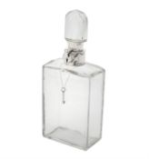 A silver mounted lockable glass decanter by Mappin & Webb.