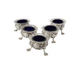 A Victorian matched set of five silver pierced cauldron salts