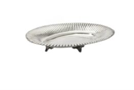 A silver coloured shaped oval dish