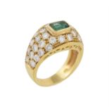 A diamond and emerald dress ring