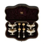 A cased set of four silver swan salts and spoons by Hilliard & Thomson