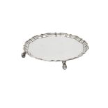 An Edwardian silver shaped circular salver by Hawksworth