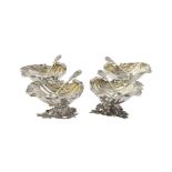 A set of four silver shell shaped salts by S. Blanckensee & Son Ltd.