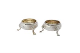 A pair of George II silver cauldron salts by James Stone
