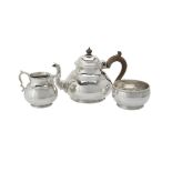 A silver circular baluster three piece tea set by Richard Comyns