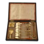 A cased French silver gilt set of twelve tea spoons