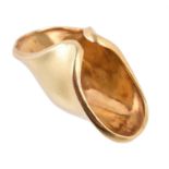 A gold coloured domed dress ring