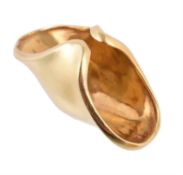 A gold coloured domed dress ring