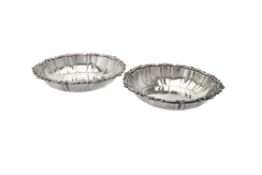 A pair of late Victorian silver shaped circular second course dishes by Catchpole & Williams Ltd.