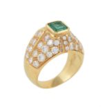 An emerald and diamond dress ring