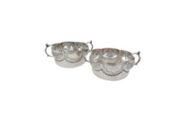 A pair of silver shaped circular twin handled bowls