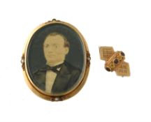 Y A late 19th century French miniature brooch and a garnet set slide