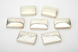 Seven silver rectangular boxes