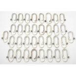 A collection of silver oval clips