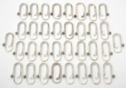 A collection of silver oval clips