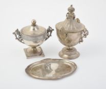 A continental silver coloured sugar bowl and cover