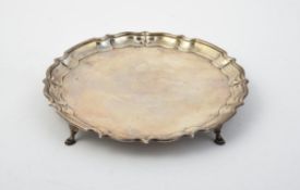 A silver shaped circular salver by Barker Brothers