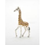 A silver coloured and enamel model of a giraffe