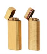 Cartier, a pair of gilt metal lighters