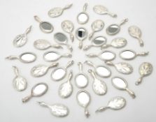 A collection of silver coloured mirror pendants