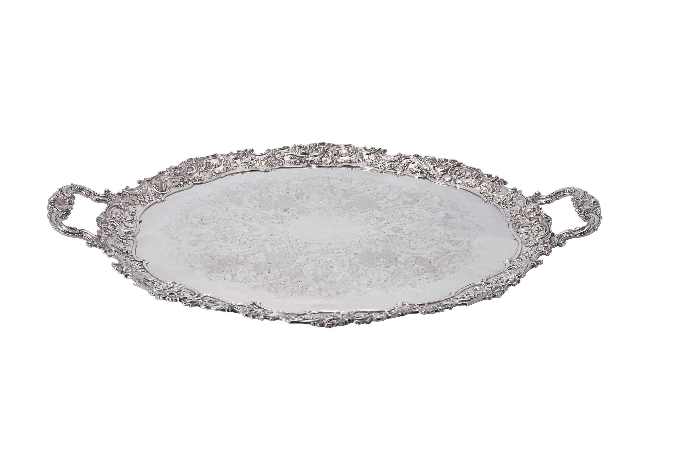 An electro-plated twin handled shaped oval tray