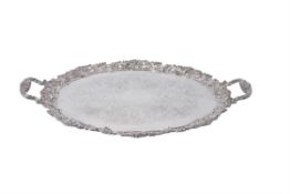 An electro-plated twin handled shaped oval tray