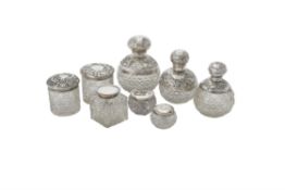 A collection of silver mounted dressing table bottles