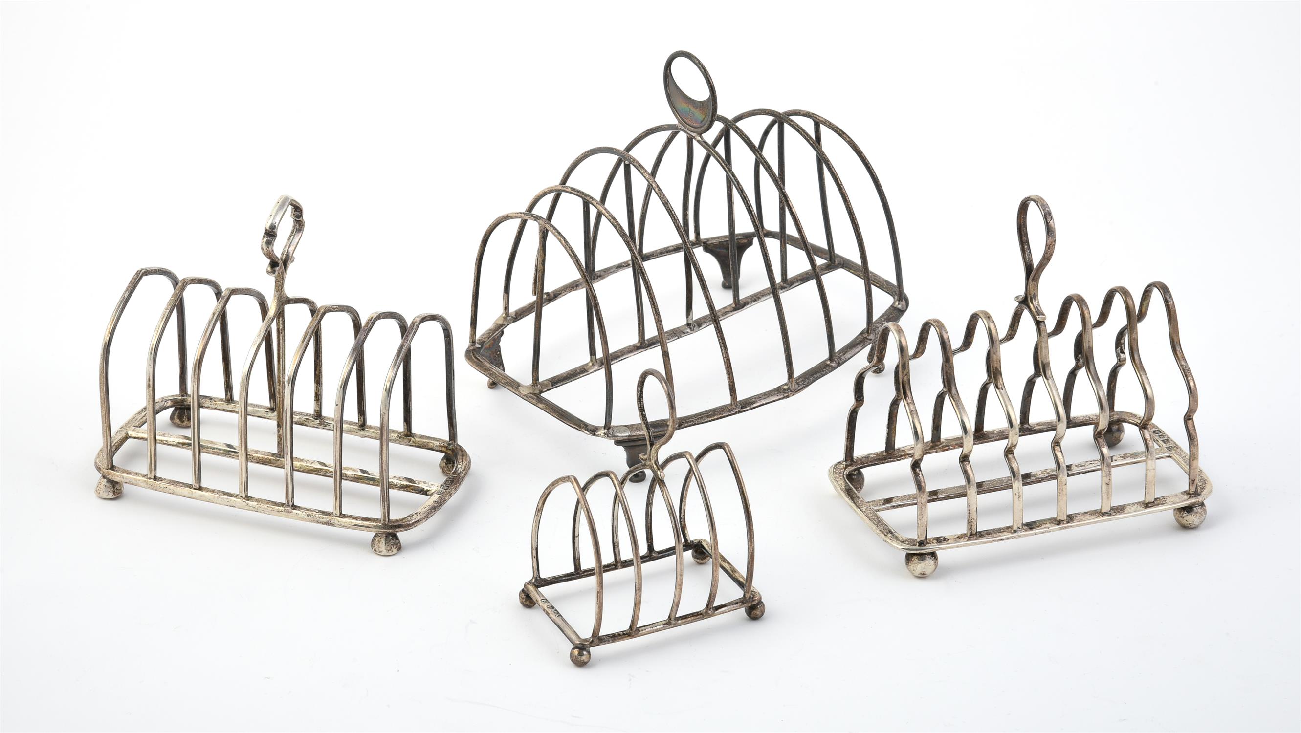 A George III silver barrel shaped six division toast rack by Mary Troby
