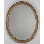 A George III oval giltwood mirror