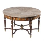 A gilt metal mounted marble topped beech round low table in Louis XVI style