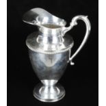 A Mexican silver water jug