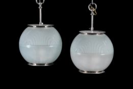 A pair of modern glass globular frosted glass light fittings