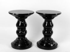 Two modern black marble pedestal columns