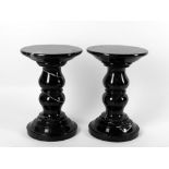 Two modern black marble pedestal columns