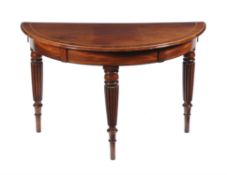 An early 19th century and later mahogany and crossbanded demilune side table