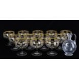 A set of twelve 20th Century large engraved gilt goblets/gin glasses