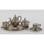 A matched Limoges porcelain and white metal overlaid five piece cabaret set