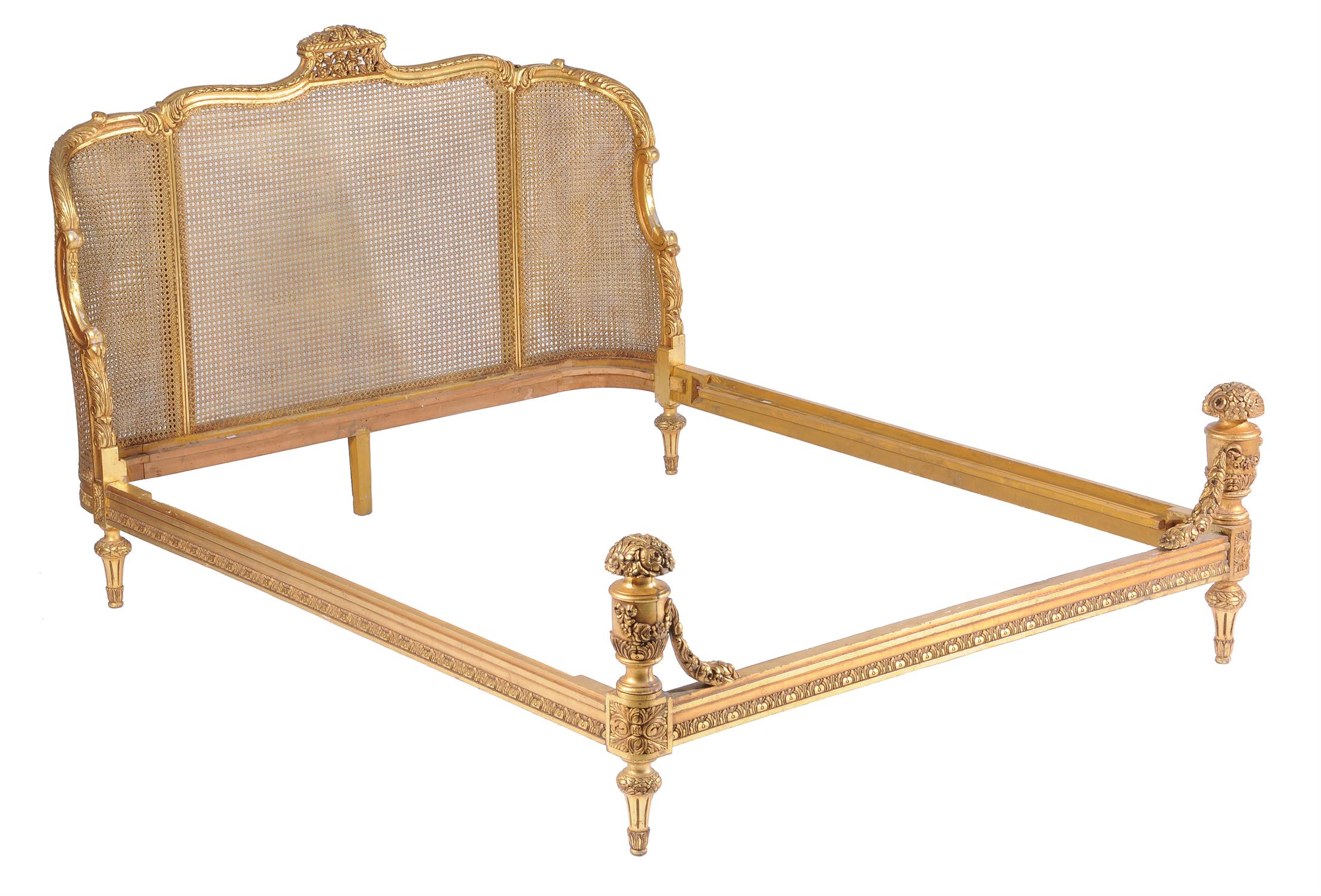 An early/mid-20th century French carved giltwood bed