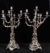 A pair of silver plated seven light candelabra in the 19th century manner