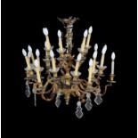 A Continental gilt-bronze and cut glass twenty-four light chandelier in Rococo taste